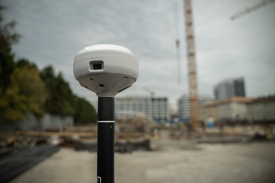 An Emlid Reach RS4 Pro GNSS receiver, the class of instrument used to survey ground control points for a drone mapping flight
